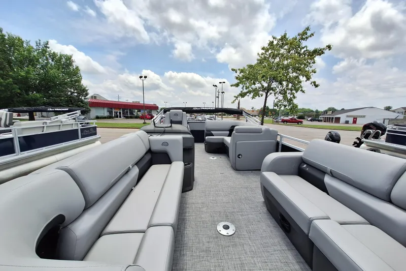 Slide: The Image of 2026 Sun Tracker SportFish 22 DLX pontoon boat with spacious seating and modern design. - 8