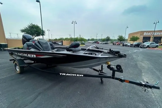 The Image of 2026 Tracker Pro Team 175 boat on trailer in parking lot. - 0