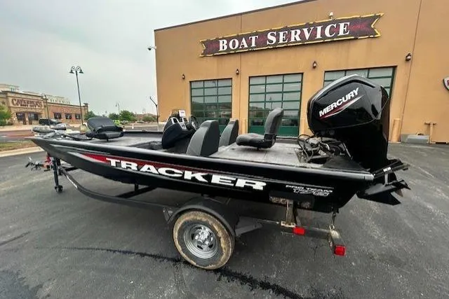 Slide: The Image of 2026 Tracker Pro Team 175 boat with Mercury engine at boat service center. - 2