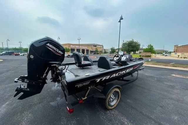 Slide: The Image of 2026 Tracker Pro Team 175 boat with Mercury engine in parking lot. - 3