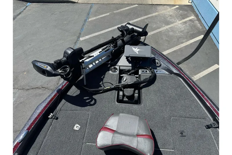 Slide: The Image of 2026 Triton 18 TrX boat deck with trolling motor and control panel. - 7