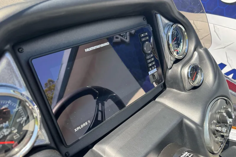 Slide: The Image of Dashboard of 2026 Triton 18 TrX with Humminbird Xplore 9 display. - 21