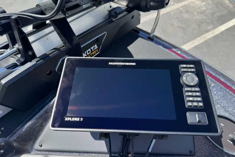 Slide: The Image of Humminbird Xplore 9 fishfinder on 2026 Triton 18 TrX boat dashboard. - 9