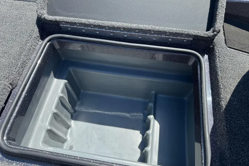 Slide: The Image of Open storage compartment in 2026 Triton 18 TrX boat, featuring durable interior design. - 19