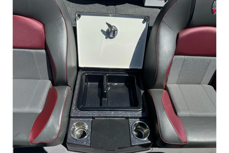 Slide: The Image of Interior of 2026 Triton 18 TrX boat with storage compartment and cup holders. - 15
