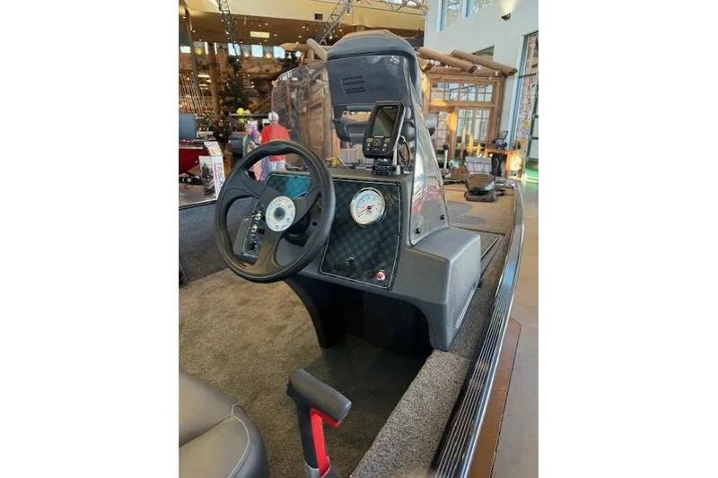 Slide: The Image of 2026 Tracker Bass Tracker Classic XL boat dashboard with steering wheel and gauges. - 5