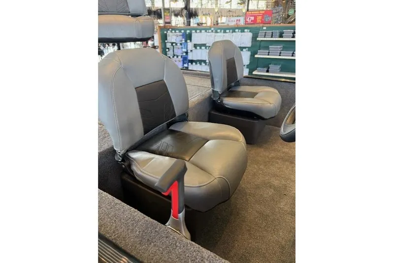 Slide: The Image of 2026 Tracker Bass Tracker Classic XL boat seats in showroom display. - 6