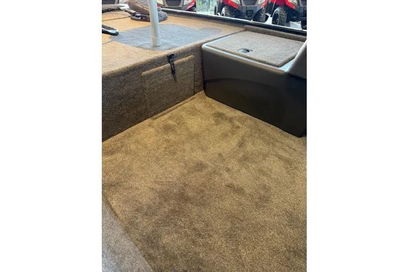 Slide: The Image of 2026 Tracker Bass Tracker Classic XL interior with carpeted flooring and storage compartment. - 7