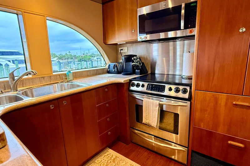 Slide: The Image of Luxurious kitchen in 2002 Cheoy Lee 72 Raised Pilot House Motor Yacht with modern appliances. - 13