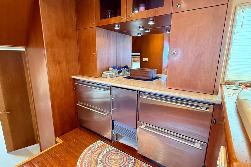 Slide: The Image of Cheoy Lee 72 yacht kitchen area with wood cabinets, 2002. - 14