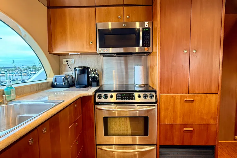 Slide: The Image of Luxurious kitchen in 2002 Cheoy Lee 72 Raised Pilot House Motor Yacht. - 15