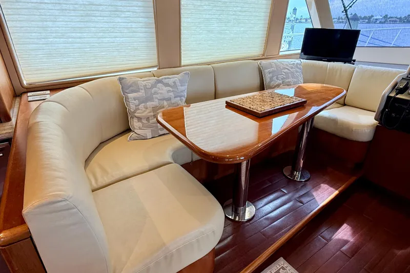 Slide: The Image of Luxurious interior of 2002 Cheoy Lee 72 Raised Pilot House Motor Yacht with elegant seating. - 17