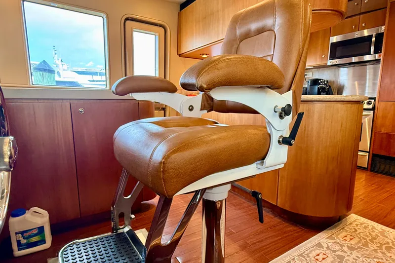 Slide: The Image of Luxurious interior of 2002 Cheoy Lee 72 Raised Pilot House Motor Yacht with captain's chair. - 21
