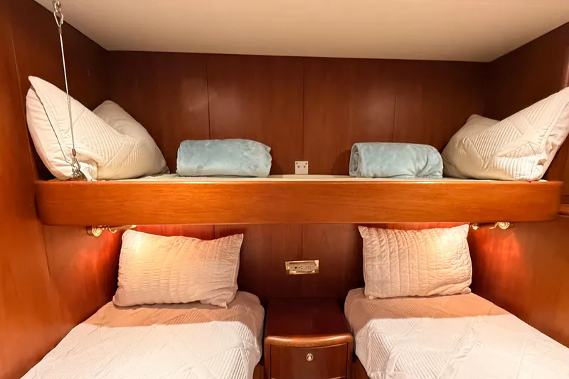 Slide: The Image of Bunk beds in 2002 Cheoy Lee 72 Raised Pilot House Motor Yacht cabin, featuring wood paneling. - 34