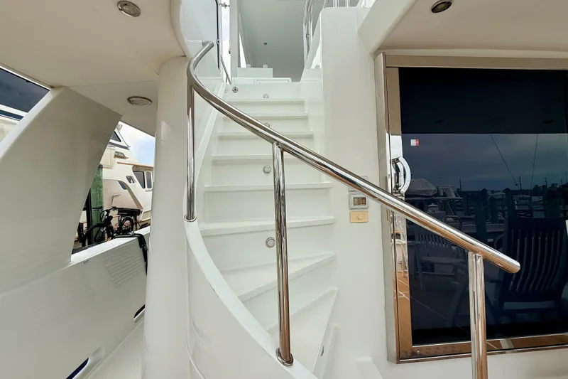 Slide: The Image of Staircase on 2002 Cheoy Lee 72 Raised Pilot House Motor Yacht, featuring sleek design and polished railing. - 38
