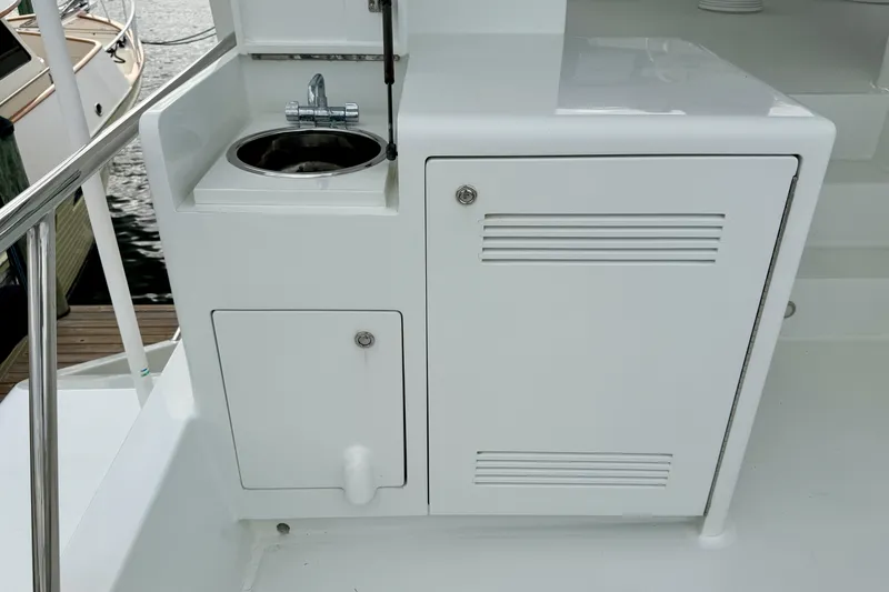 Slide: The Image of Outdoor sink and storage on 2002 Cheoy Lee 72 Raised Pilot House Motor Yacht. - 40