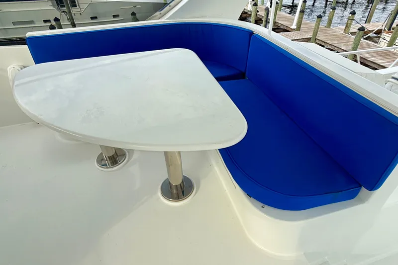 Slide: The Image of Blue cushioned seating and table on 2002 Cheoy Lee 72 Raised Pilot House Yacht. - 43