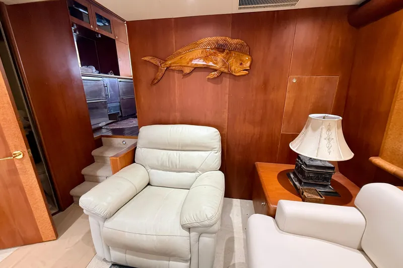 Slide: The Image of Luxurious interior of 2002 Cheoy Lee 72 yacht with leather seating and wooden decor. - 9