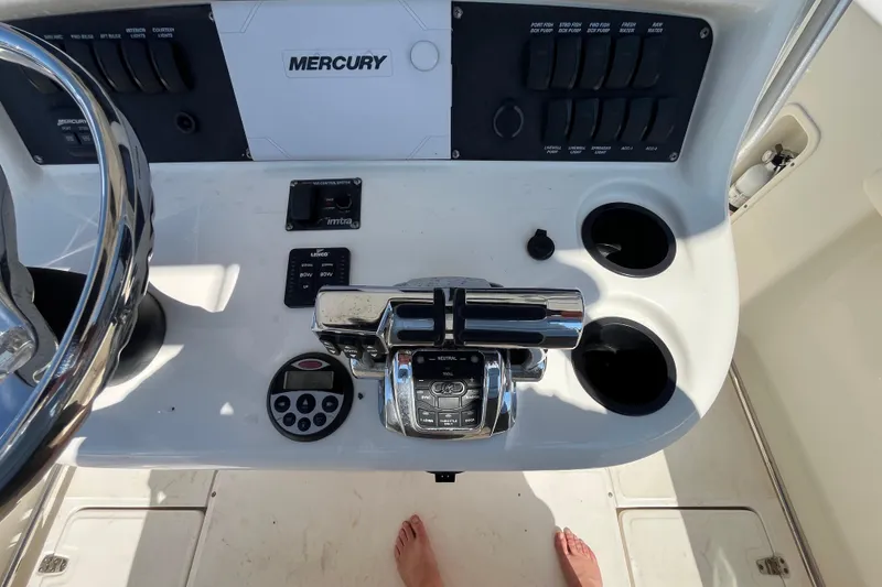 Slide: The Image of Control panel of a 2007 Boston Whaler 270 Outrage boat with Mercury controls. - 16