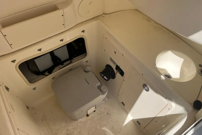 Slide: The Image of 2007 Boston Whaler 270 Outrage interior with storage and sink. - 29