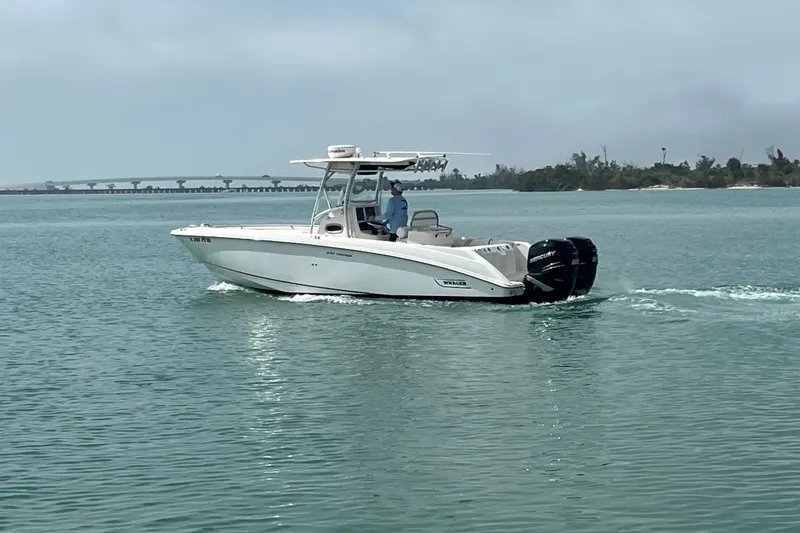Slide: The Image of 2007 Boston Whaler 270 Outrage boat cruising on calm waters. - 4