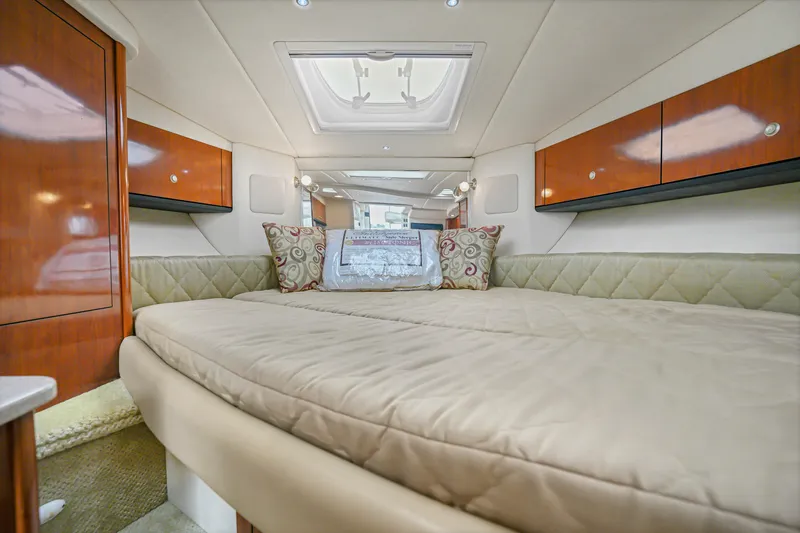 Slide: The Image of Luxurious interior cabin of 2007 Sea Ray 310 Sundancer yacht with cozy bedding. - 11