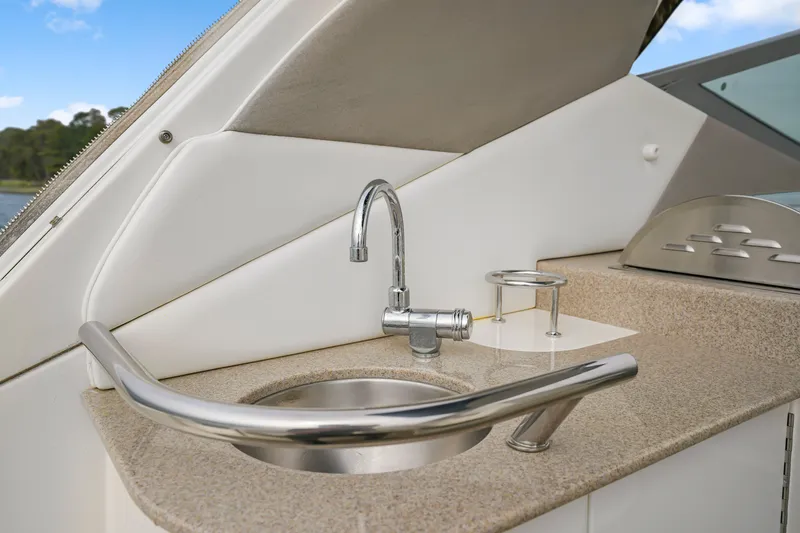 Slide: The Image of 2007 Sea Ray 310 Sundancer boat sink and countertop detail. - 18