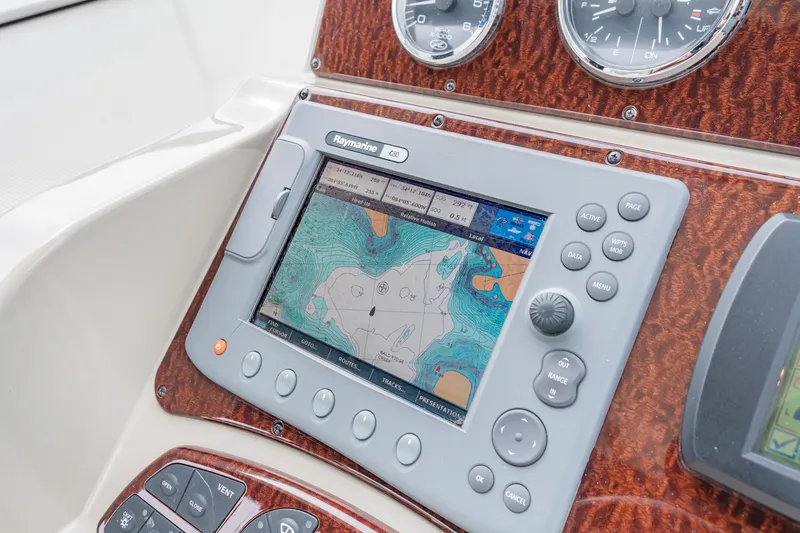 Slide: The Image of Navigation system on 2007 Sea Ray 310 Sundancer boat dashboard with map display. - 23