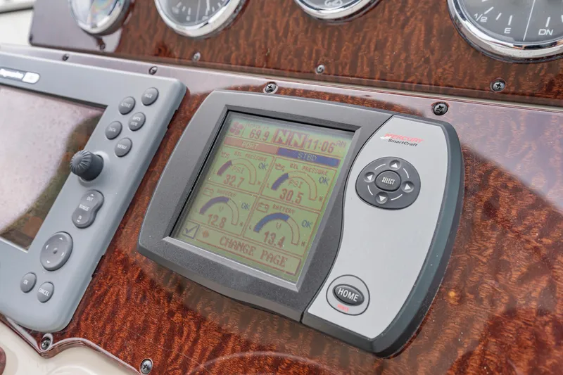 Slide: The Image of Dashboard of 2007 Sea Ray 310 Sundancer with navigation and control systems. - 24