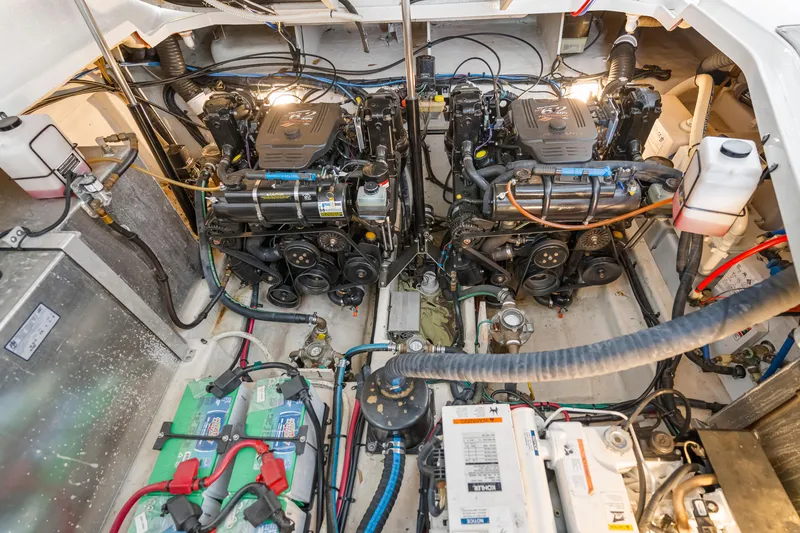 Slide: The Image of Engine room of 2007 Sea Ray 310 Sundancer with dual engines and batteries. - 5