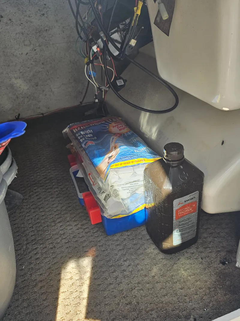 Slide: The Image of Interior of a 2002 Godfrey Hurricane Sundeck 187 boat with accessories. - 16