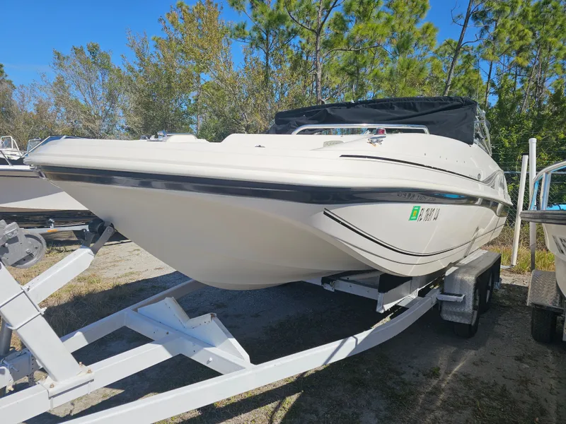 Slide: The Image of 2002 Godfrey Hurricane Sundeck 187 on trailer outdoors. - 2