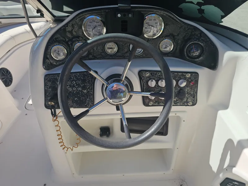 Slide: The Image of Steering console of a 2002 Godfrey Hurricane Sundeck 187 boat. - 4