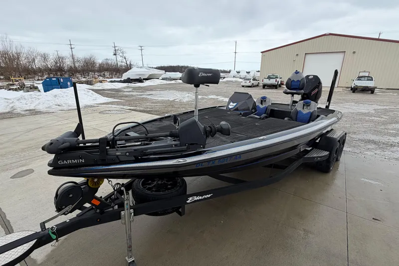 Slide: The Image of 2023 Blazer 650 Pro Tour boat with Garmin equipment on a trailer in snowy lot. - 1