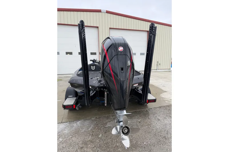 Slide: The Image of 2023 Blazer 650 Pro Tour boat, rear view with powerful outboard motor. - 3