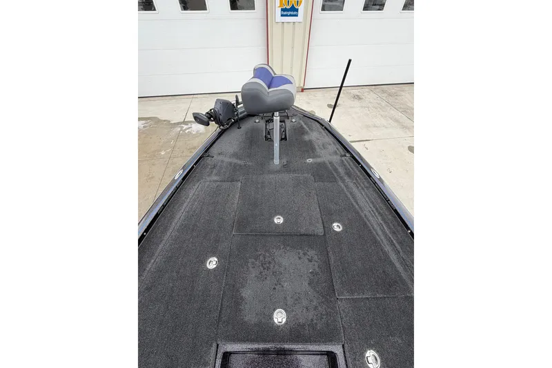 Slide: The Image of 2023 Blazer 650 Pro Tour boat deck with seating and storage compartments. - 4