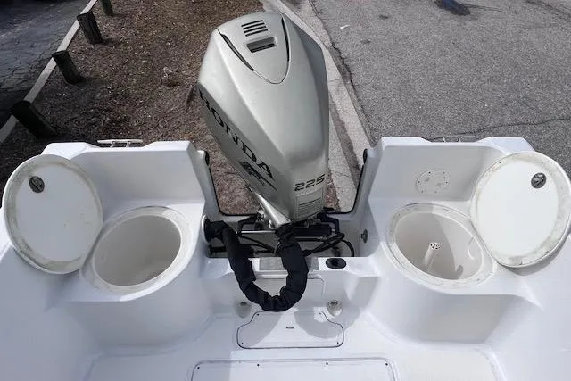 Slide: The Image of 2008 Angler PANGA 22 boat with Honda 225 outboard motor, dual storage compartments. - 12