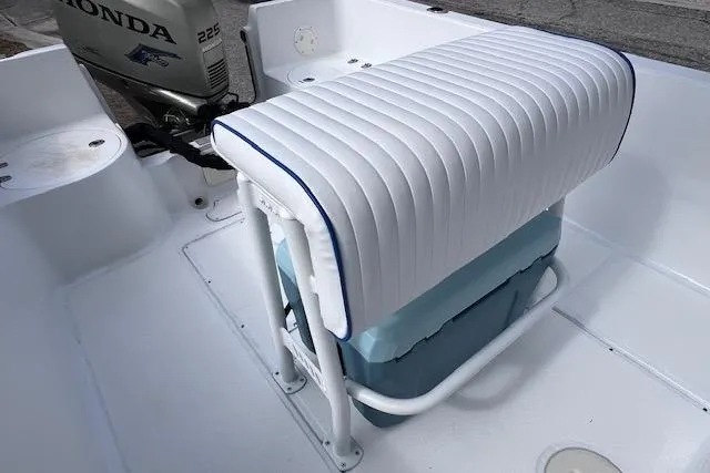 Slide: The Image of 2008 Angler PANGA 22 boat interior with white cushioned seating and Honda outboard motor. - 14