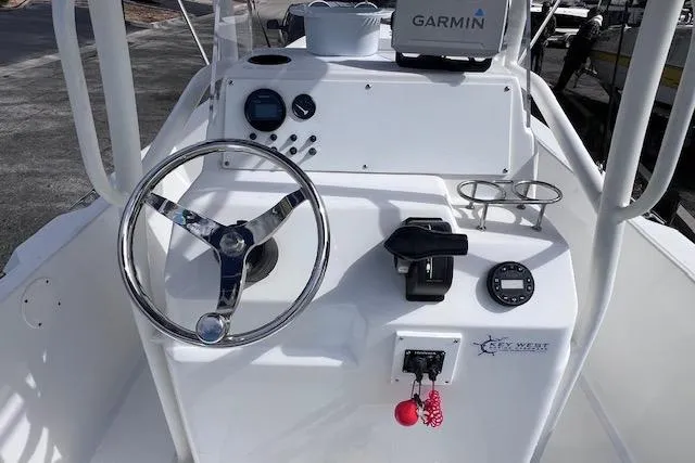 Slide: The Image of 2008 Angler PANGA 22 boat dashboard with Garmin navigation system and steering wheel. - 15