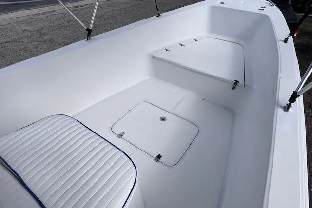 Slide: The Image of 2008 Angler PANGA 22 boat interior with white seating and storage compartments. - 19