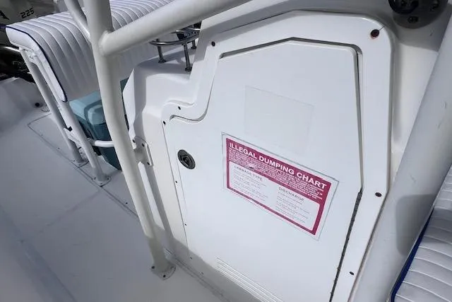 Slide: The Image of 2008 Angler PANGA 22 boat interior with illegal dumping chart on white panel. - 25