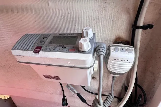 Slide: The Image of Marine radio equipment on a 2008 Angler PANGA 22 boat, featuring a microphone and control panel. - 27