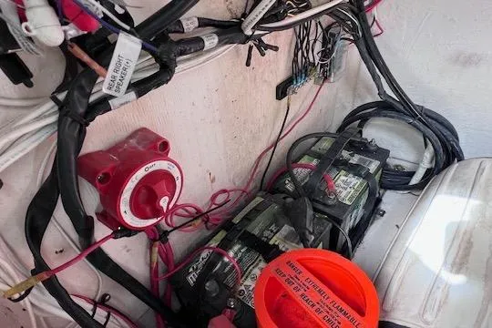 Slide: The Image of Electrical setup in a 2008 Angler PANGA 22 boat, featuring batteries and wiring. - 29