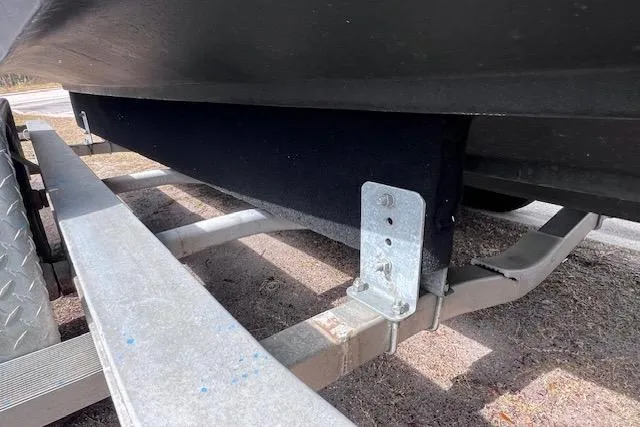 Slide: The Image of Trailer supporting a 2008 Angler PANGA 22 boat, showing metal frame and carpeted bunks. - 30