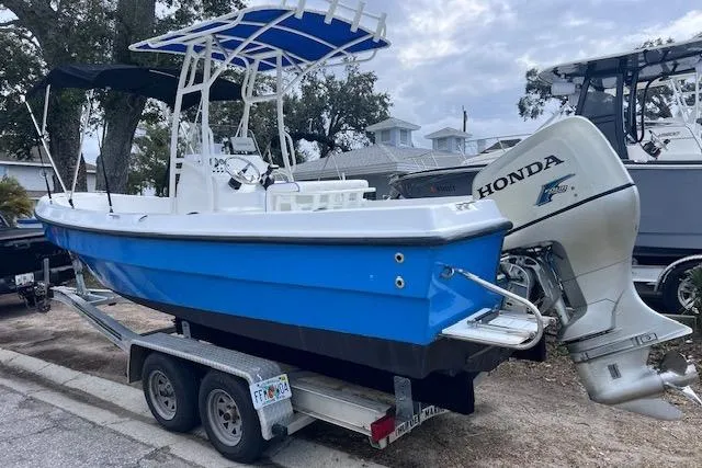 Slide: The Image of 2008 Angler PANGA 22 boat with Honda outboard motor on trailer. - 2