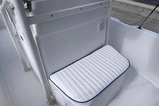 Slide: The Image of 2008 Angler PANGA 22 boat seat with white cushioned upholstery. - 21