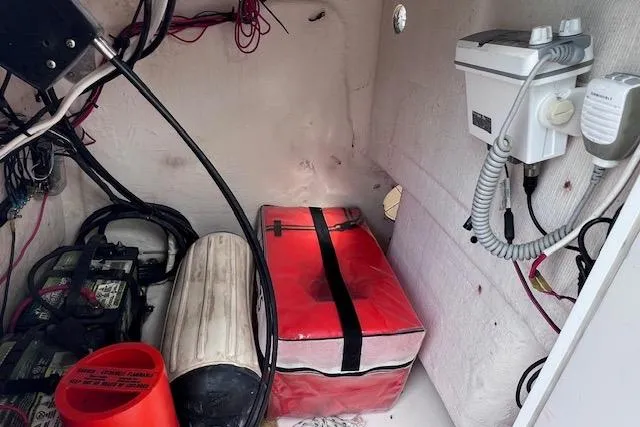 Slide: The Image of Interior of a 2008 Angler PANGA 22 boat showing equipment and storage. - 26