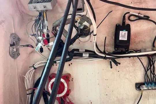 Slide: The Image of Electrical wiring inside a 2008 Angler PANGA 22 boat, showcasing cables and components. - 28