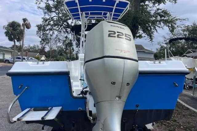 Slide: The Image of 2008 Angler PANGA 22 boat with Honda 225 outboard motor, blue and white design. - 3