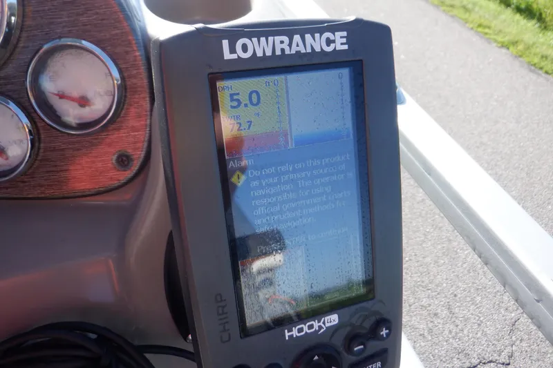 Slide: The Image of Lowrance Hook 4x fishfinder on 2009 Premier 225 Sunsation LTD boat dashboard. - 29